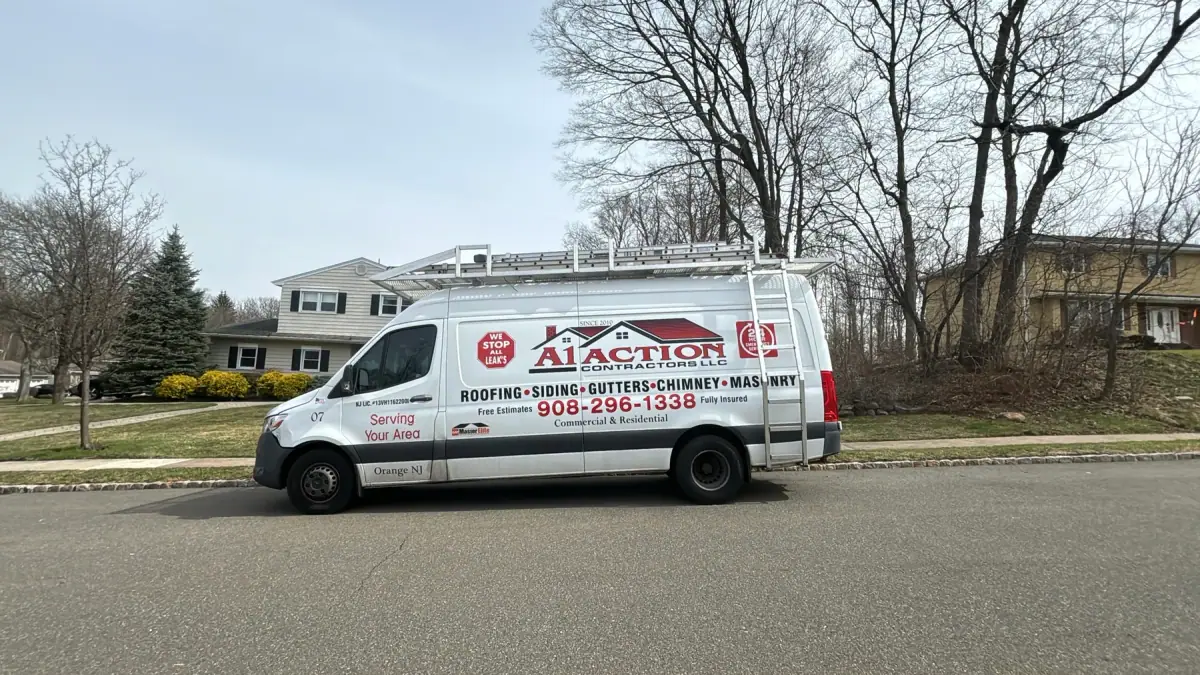 The A1 Action Contractors van parked on a street, the trades and phone number on the side