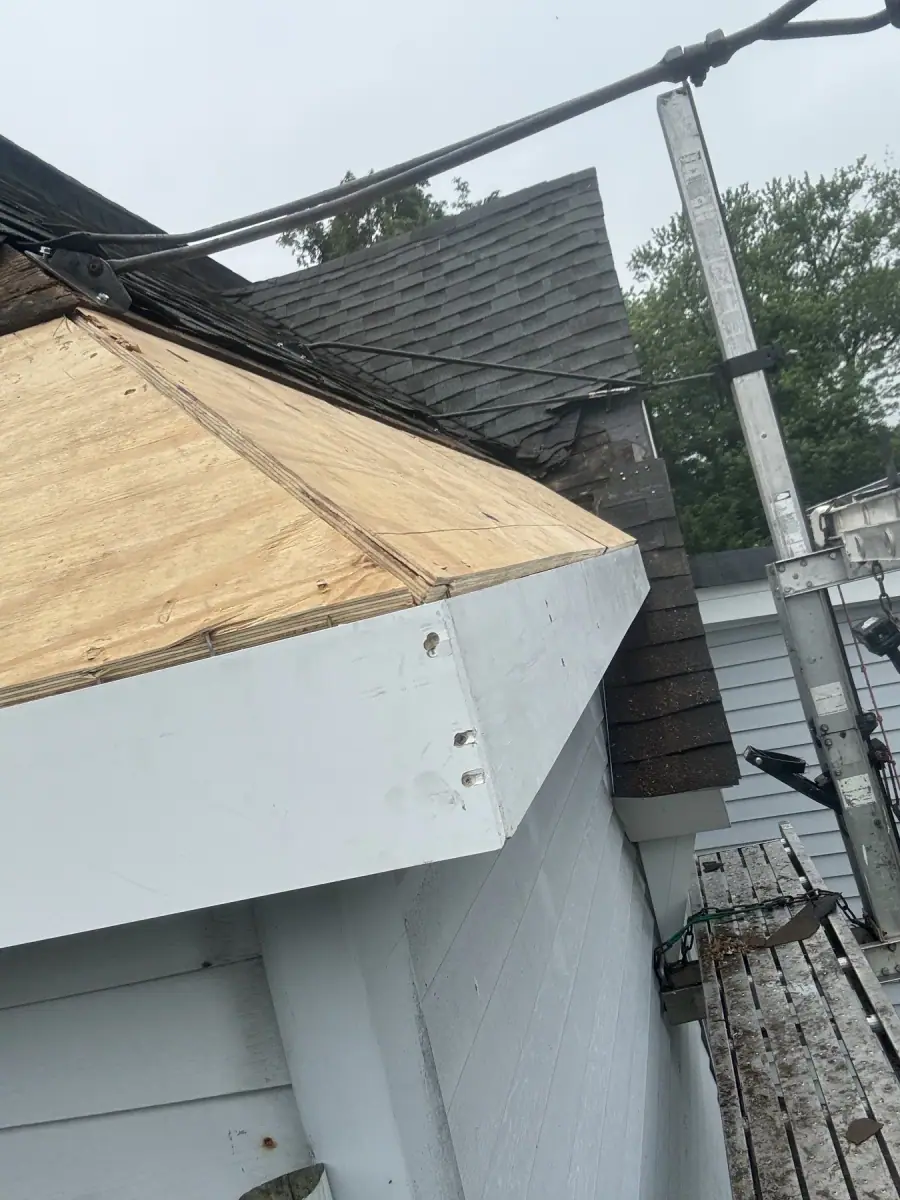 New plywood and white fascia fitted where a roof cornice was rebuilt